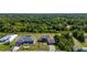 Expansive aerial view of a single Gathering home surrounded by lush green trees and beautiful landscaping at 1606 Navigator Rd, Punta Gorda, FL 33983