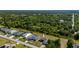 Aerial view of a single Gathering home with lush green trees and lawn at 1606 Navigator Rd, Punta Gorda, FL 33983