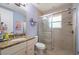 Bathroom with granite countertops, a large mirror, and a sliding glass door shower at 1606 Navigator Rd, Punta Gorda, FL 33983