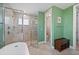 En-suite bathroom with a soaking tub, large glass shower, and a convenient toilet room at 1606 Navigator Rd, Punta Gorda, FL 33983