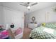 Bedroom with neutral carpet, fan, and large closet offers both style and functionality at 1606 Navigator Rd, Punta Gorda, FL 33983