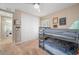 Comfortable carpeted bedroom features a bunk bed and a spacious closet at 1606 Navigator Rd, Punta Gorda, FL 33983