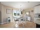 Bright dining area featuring a modern table with seating, natural light, and decor at 1606 Navigator Rd, Punta Gorda, FL 33983