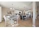 Bright kitchen featuring white cabinets, granite countertops, a central island with seating, and stainless steel appliances at 1606 Navigator Rd, Punta Gorda, FL 33983