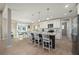 Bright kitchen with white cabinets, granite countertops, a central island with seating, and stainless steel appliances at 1606 Navigator Rd, Punta Gorda, FL 33983