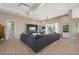 Bright living room showcasing a large sectional sofa, coffered ceiling, and neutral color palette at 1606 Navigator Rd, Punta Gorda, FL 33983