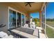 Enjoy the outdoors on this screened-in patio with ample seating and a ceiling fan at 1606 Navigator Rd, Punta Gorda, FL 33983