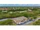 Aerial view showcasing the building adjacent to a waterway, and the parking area for residents and guests at 175 Kings Hwy # B2 1522, Punta Gorda, FL 33983