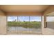 Screened balcony view showcases beautiful lake and lush foliage, offering a serene outdoor space at 175 Kings Hwy # B2 1522, Punta Gorda, FL 33983