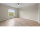 Bright bedroom featuring sleek floors, neutral walls, and a ceiling fan, creates a modern and inviting atmosphere at 175 Kings Hwy # B2 1522, Punta Gorda, FL 33983
