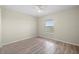 This bedroom features stylish wood flooring, a ceiling fan and a window that provides natural light to the space at 175 Kings Hwy # B2 1522, Punta Gorda, FL 33983