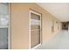Exterior door to unit 1522 along the second story outdoor walkway of the condo building at 175 Kings Hwy # B2 1522, Punta Gorda, FL 33983