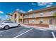 Exterior of a condo building featuring covered stairwells, balconies, and assigned parking spaces at 175 Kings Hwy # B2 1522, Punta Gorda, FL 33983