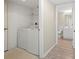 Functional laundry area equipped with a washer, dryer, and built-in storage shelves for added convenience at 175 Kings Hwy # B2 1522, Punta Gorda, FL 33983