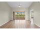 Inviting living room features wood-look floors and a sliding glass door to balcony overlooking scenic water views at 175 Kings Hwy # B2 1522, Punta Gorda, FL 33983