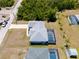 Aerial view of the property featuring a pool and fenced in backyard at 2229 Wakefield St, Port Charlotte, FL 33948