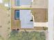Aerial view of the home, featuring a private pool and driveway at 2229 Wakefield St, Port Charlotte, FL 33948