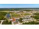 Aerial view of house with baseball fields, ponds and neighborhood amenities in the distance at 2229 Wakefield St, Port Charlotte, FL 33948
