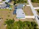 Aerial view of the property featuring a private pool and tropical landscaping at 2229 Wakefield St, Port Charlotte, FL 33948