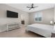 Cozy bedroom with a mounted TV and an ensuite bathroom at 2229 Wakefield St, Port Charlotte, FL 33948