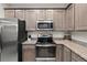 Modern kitchen with stainless steel appliances and granite countertops at 2229 Wakefield St, Port Charlotte, FL 33948