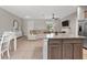 Open-concept kitchen with granite countertops, stainless steel appliances, and large island at 2229 Wakefield St, Port Charlotte, FL 33948