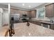 Modern kitchen featuring granite countertops, stainless steel appliances, and ample cabinet space at 2229 Wakefield St, Port Charlotte, FL 33948