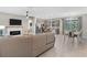 An open concept living space flows into the kitchen and dining area, filled with natural light at 2229 Wakefield St, Port Charlotte, FL 33948