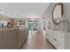 Spacious living area with modern decor, flowing into kitchen and dining spaces; tiled floors at 2229 Wakefield St, Port Charlotte, FL 33948