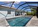 Inviting screened in pool area perfect for relaxation, featuring tile deck and outdoor seating at 2229 Wakefield St, Port Charlotte, FL 33948