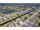 Wide aerial view of waterfront homes on a canal, showing the neighborhood and community at 229 Sportsman Rd, Rotonda West, FL 33947