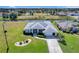 Aerial view of the home, showcasing the well-manicured lawn and appealing curb appeal at 229 Sportsman Rd, Rotonda West, FL 33947