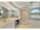 Bright bathroom with dual sinks, walk-in shower, and ample counter space at 229 Sportsman Rd, Rotonda West, FL 33947