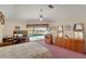 Spacious bedroom with pool views, a work area, and ample storage space at 229 Sportsman Rd, Rotonda West, FL 33947