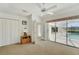 Bedroom features closet and sliding glass doors with pool view at 229 Sportsman Rd, Rotonda West, FL 33947