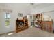 Cozy bedroom with a vaulted ceiling, large windows, and a view of the yard at 229 Sportsman Rd, Rotonda West, FL 33947