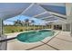 Screened-in pool area with tropical landscaping views and a covered patio at 229 Sportsman Rd, Rotonda West, FL 33947