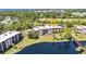 An aerial view of a waterfront condo complex with lush green landscaping at 23465 Harborview Rd # 842, Port Charlotte, FL 33980