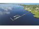 Elevated view showcases docks and a serene waterfront setting, perfect for boating and enjoying the natural beauty at 23465 Harborview Rd # 842, Port Charlotte, FL 33980