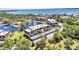 An aerial view showcases the community's low-rise buildings, lush grounds, and convenient parking at 23465 Harborview Rd # 842, Port Charlotte, FL 33980