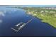Breathtaking aerial perspective of waterfront property with docks and boat slips, ideal for coastal living at 23465 Harborview Rd # 842, Port Charlotte, FL 33980