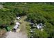 Aerial view showcasing property with boat storage, surrounded by lush greenery at 23465 Harborview Rd # 842, Port Charlotte, FL 33980
