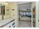 Bathroom view into the bedroom with bay windows and seating area at 23465 Harborview Rd # 842, Port Charlotte, FL 33980