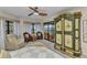 Bedroom showing balcony access, bay windows and an antique wardrobe at 23465 Harborview Rd # 842, Port Charlotte, FL 33980