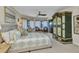Bedroom boasts a bay window with seating and access to a balcony at 23465 Harborview Rd # 842, Port Charlotte, FL 33980