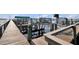 Wooden dock with boat lifts and docks, providing convenient access to the waterway at 23465 Harborview Rd # 842, Port Charlotte, FL 33980
