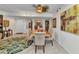 Dining room with a ceiling fan, wall art, and a table with six chairs at 23465 Harborview Rd # 842, Port Charlotte, FL 33980