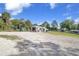 Exterior view of a boat storage facility with ample parking and green surroundings at 23465 Harborview Rd # 842, Port Charlotte, FL 33980