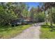 Landscaped walking path with boat racks in a tranquil, wooded setting at 23465 Harborview Rd # 842, Port Charlotte, FL 33980