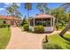 Charming gazebo amidst manicured landscaping, perfect for relaxation and outdoor enjoyment in a serene setting at 23465 Harborview Rd # 842, Port Charlotte, FL 33980